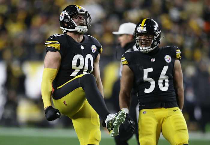 Jan 3, 2022; Pittsburgh, Pennsylvania, USA; Pittsburgh Steelers outside linebacker T.J. Watt (90) reacts alongside outside linebacker Alex Highsmith (56) after Watt recorded a sack against the Cleveland Browns during the first quarter at Heinz Field. Mandatory Credit: Charles LeClaire-USA TODAY Sports